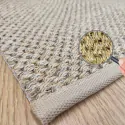 the corner of the rug, with beige border and beige mat color
