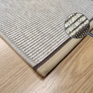 beige synthetic sisal rug of waterproof synthetic  fibers with beige brown sewed border