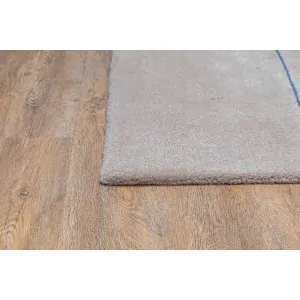 corner of beige carpet from Lefkos, a carpet and linen store in Corinth