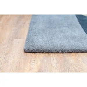 corner of gray blue carpet from Lefkos, a carpet and linen store in Corinth