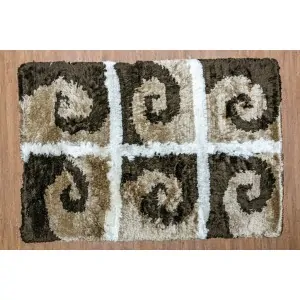 Color: rug with 6 geometric spiral wave shapes in brown and beige divided into 6 white squares