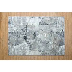 discount carpet Color: gray white with beige asymmetrical abstract triangle patterns