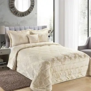 cream golden bed spread in a modern bed room in Greece