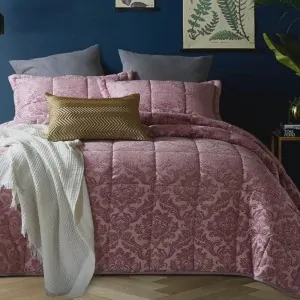 pink and white quilt with rhombic quilted patterns
