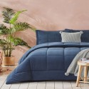 navy blue duvet by liolios home with quilted designs on a bed