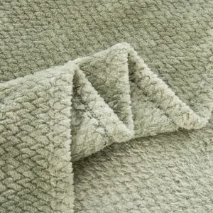 green soft blanket on bed at lefko shop