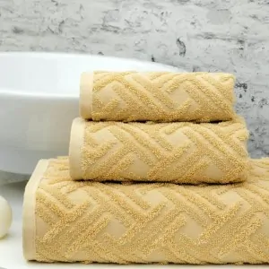 dusty yellow milano towels set by greek brand Liolios Home in a bathroom in Peloponnese