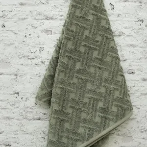 hanged dusty green cotton towels by Liolios Home in Leyko Korinthos