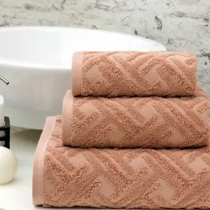 dusty pink milano towels set by greek brand Liolios Home in a greek bathroom Korinthia