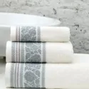 white towels Liolios Home with grey roses in a greek bathroom