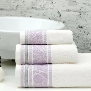 white towels Liolios Home with lila roses in a greek bathroom