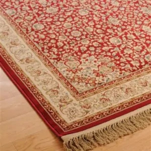 the corner of the classic red carpet Orian 2332 in Lefko Korinthia