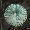 light blue round pillow with pleats with velvet texture, on a black background