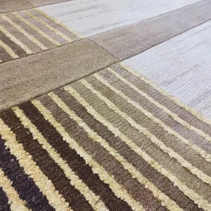 the striped beige brown cream spot of the Pierre Cardin rug