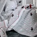 Baby crib quilt white gray with black and white dog pattern and red stitching. Down Town in White