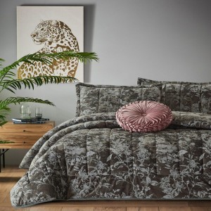 dark gray quilt with light gray floral patterns designs