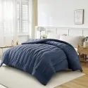 WARM QUILT DOHA NAVY on a double bed