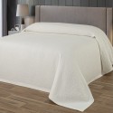 bed made with the off-white cotton blanket from the company liolios home