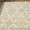 beige blanket with grey pattern