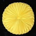 yellow round pillow with pleats with velvet texture, on a black background