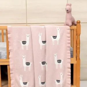 blanket bebe pink with lama patterns in a baby crib in lefko shop Corinth