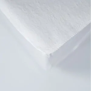 flannel mattress protection cover on bed in lefko shop