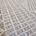 summer rug with wicker weave in gray and white with geometric patterns such as triangles, for boho decoration