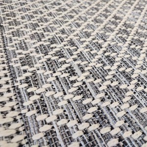 summer rug with wicker weave in gray, beige, black and with white geometric patterns such as rhombuses