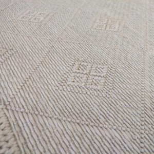 Summer rug with beige wicker weave with large and smaller rhombuses, for boho decoration