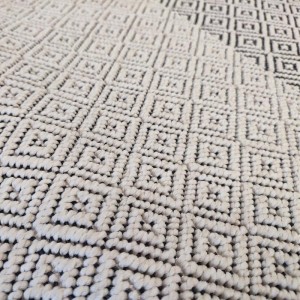 summer rug with wicker weave, white and black with small diamonds, for boho decoration