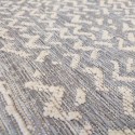 Summer synthetic runner rug with wicker weave in shades of ecru, gray, with vintage abstract waves