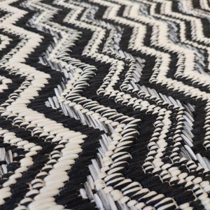 Summer synthetic runner rug with wicker black, white and gray, with a zig zag pattern