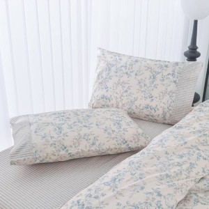Tamara bed set by greek brand Liolios Home on a bed at lefko shop