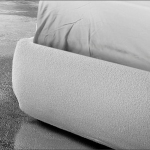 bed heart that has white upholstery all over