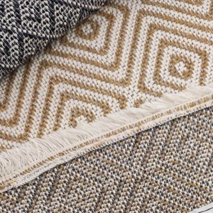 Woven rug with cream parallel geometric patterns and white fringe
